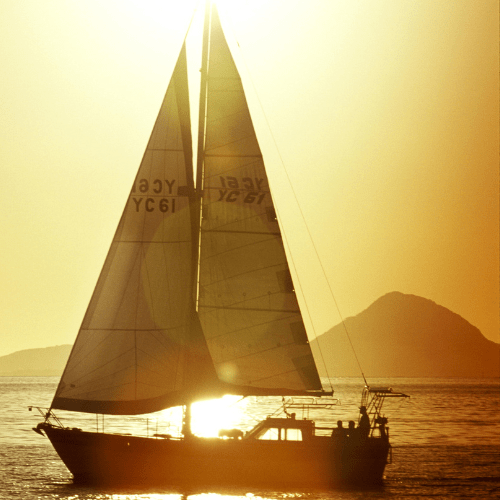 Sailboat cruising during sunset on Lake St. Clair